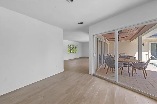a bedroom with a bed and a view of kitchen
