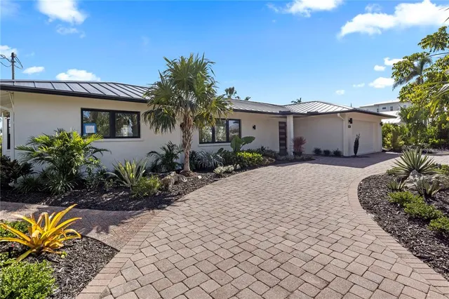 an aerial view of a house with a yard and garden