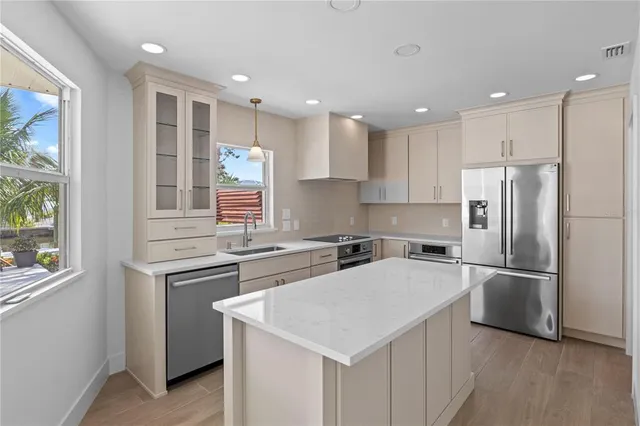 a bedroom with a bed window and a flat screen tv