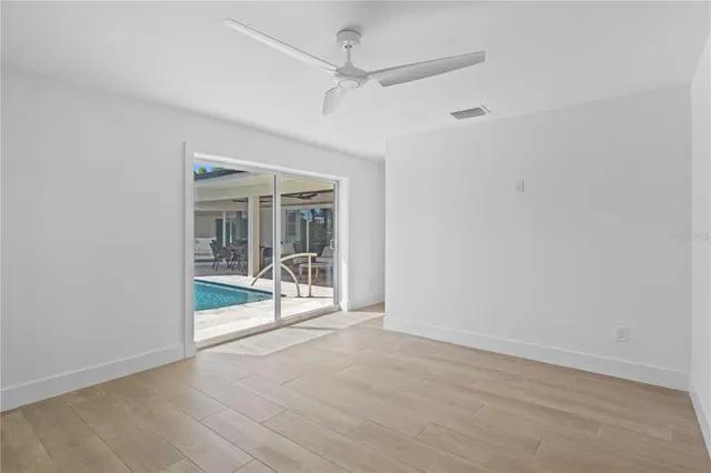 a view of a hallway with an entryway door
