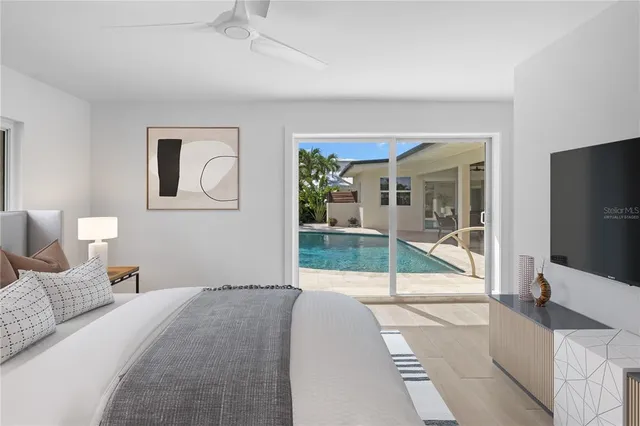 a view of an outdoor dining space with a table and chairs