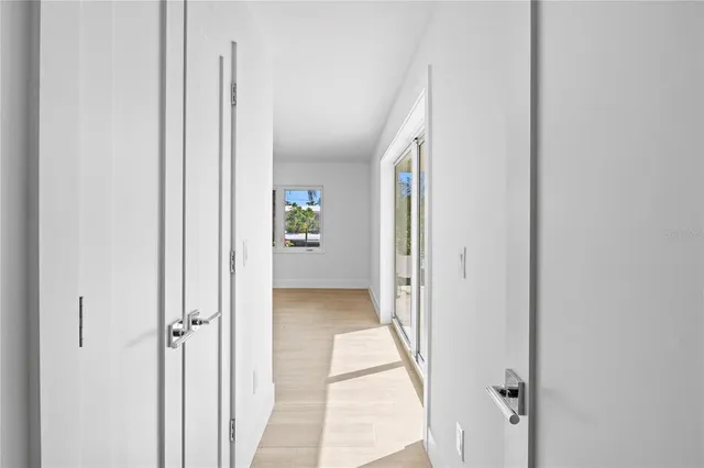 a view of a house with swimming pool and sitting area