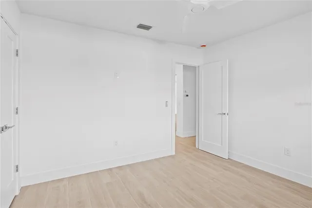 a view of a house with swimming pool and sitting area