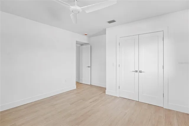 a view of a house with backyard porch and sitting area