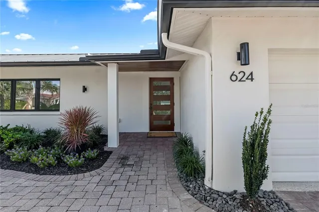 a view of swimming pool with outdoor seating and plants