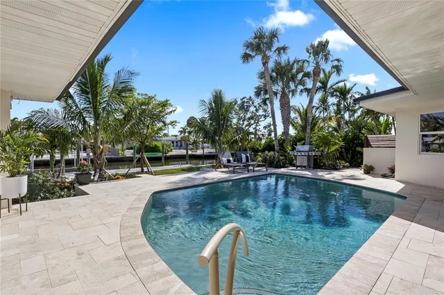 a view of house with swimming pool