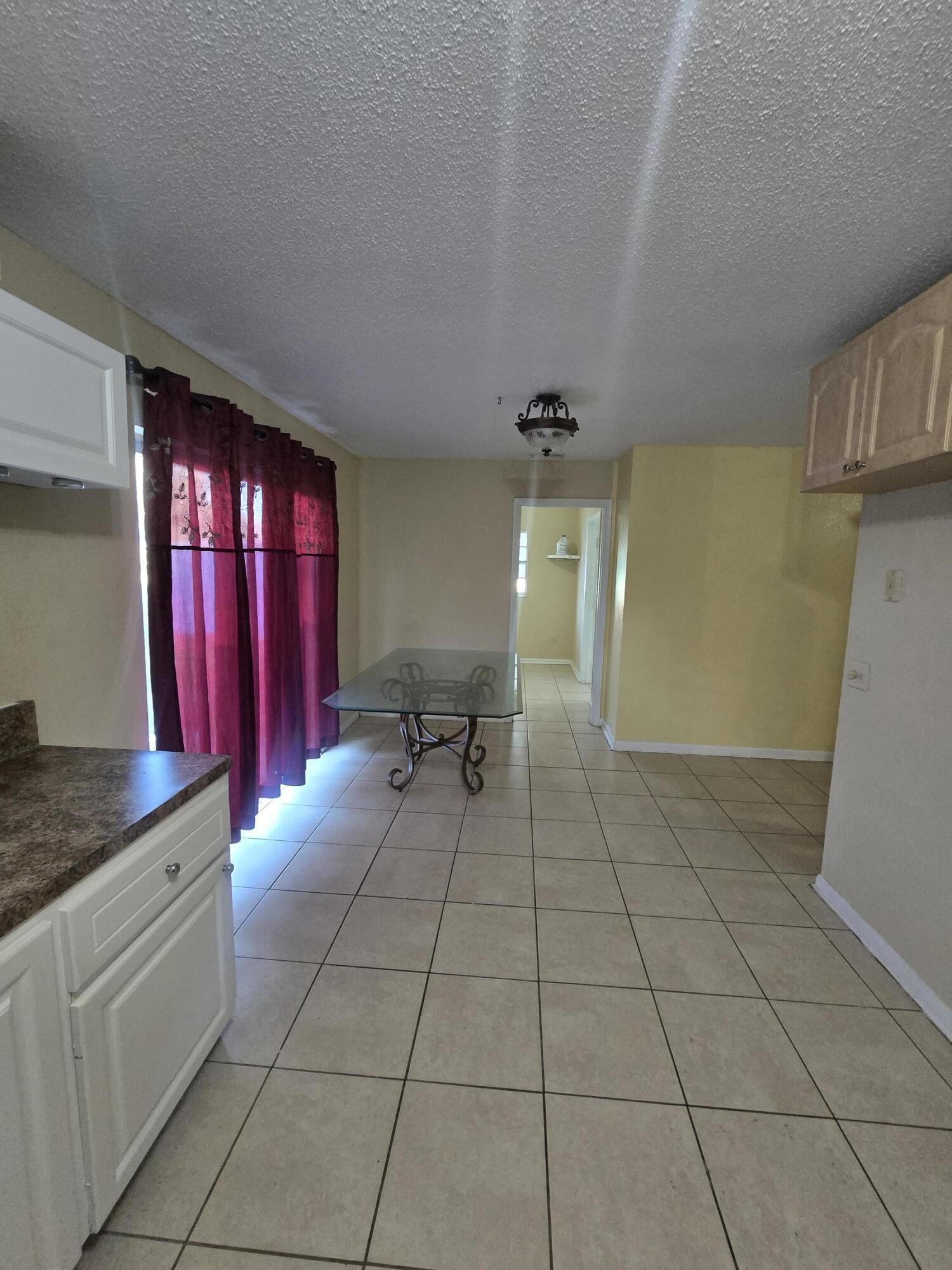 3751 Northwest 36th Street Okeechobee, FL 34972 - Photo 5 of 11 a view of a livingroom with furniture and a window