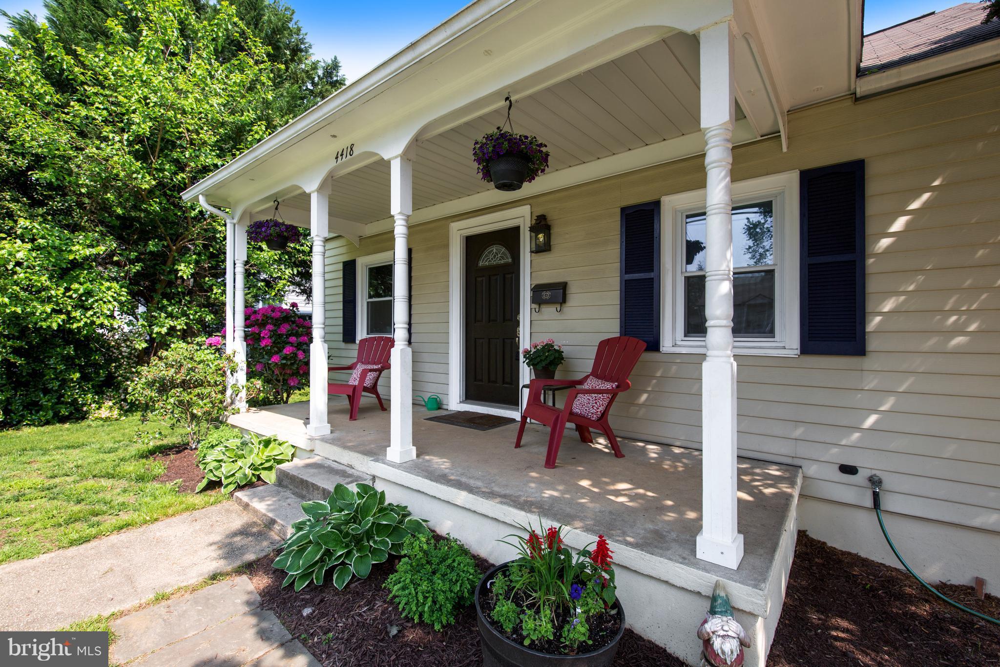 4418 Bennion Road Silver Spring, MD 20906 - Photo 2 of 23 a view of a chair and tables in the patio with a fire pit