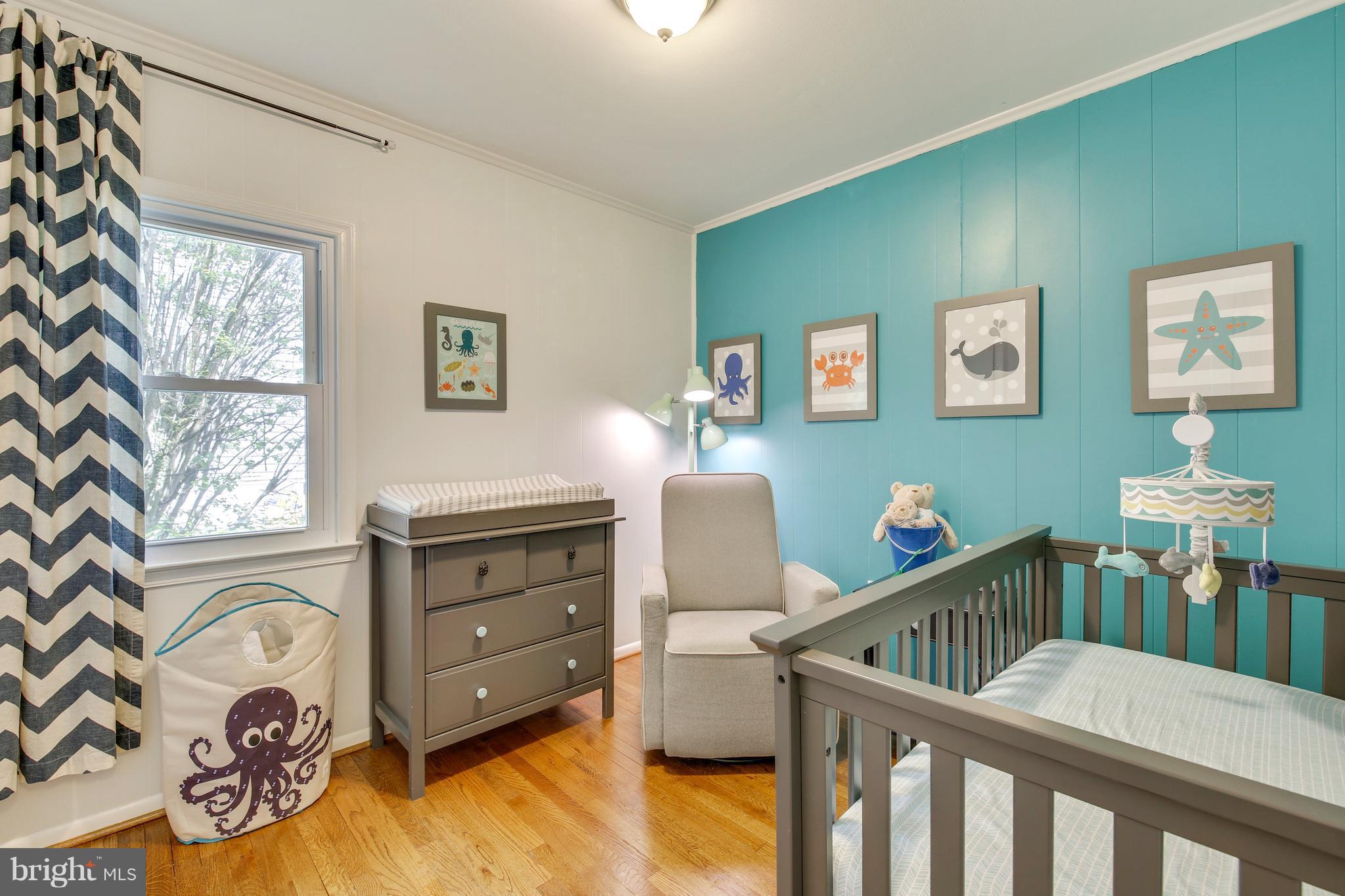 4418 Bennion Road Silver Spring, MD 20906 - Photo 13 of 23 a bedroom with a bed and a window