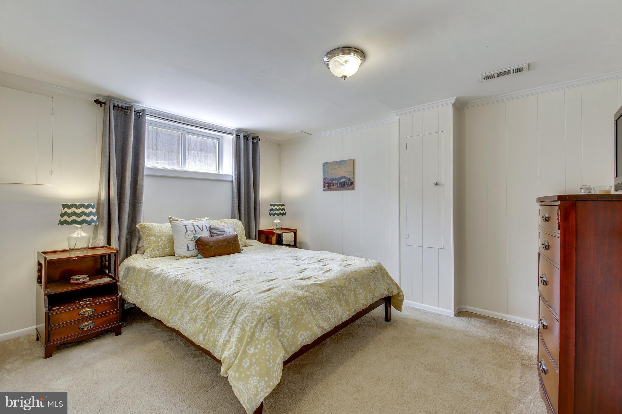 4418 Bennion Road Silver Spring, MD 20906 - Photo 15 of 23 a bedroom with a bed and a closet