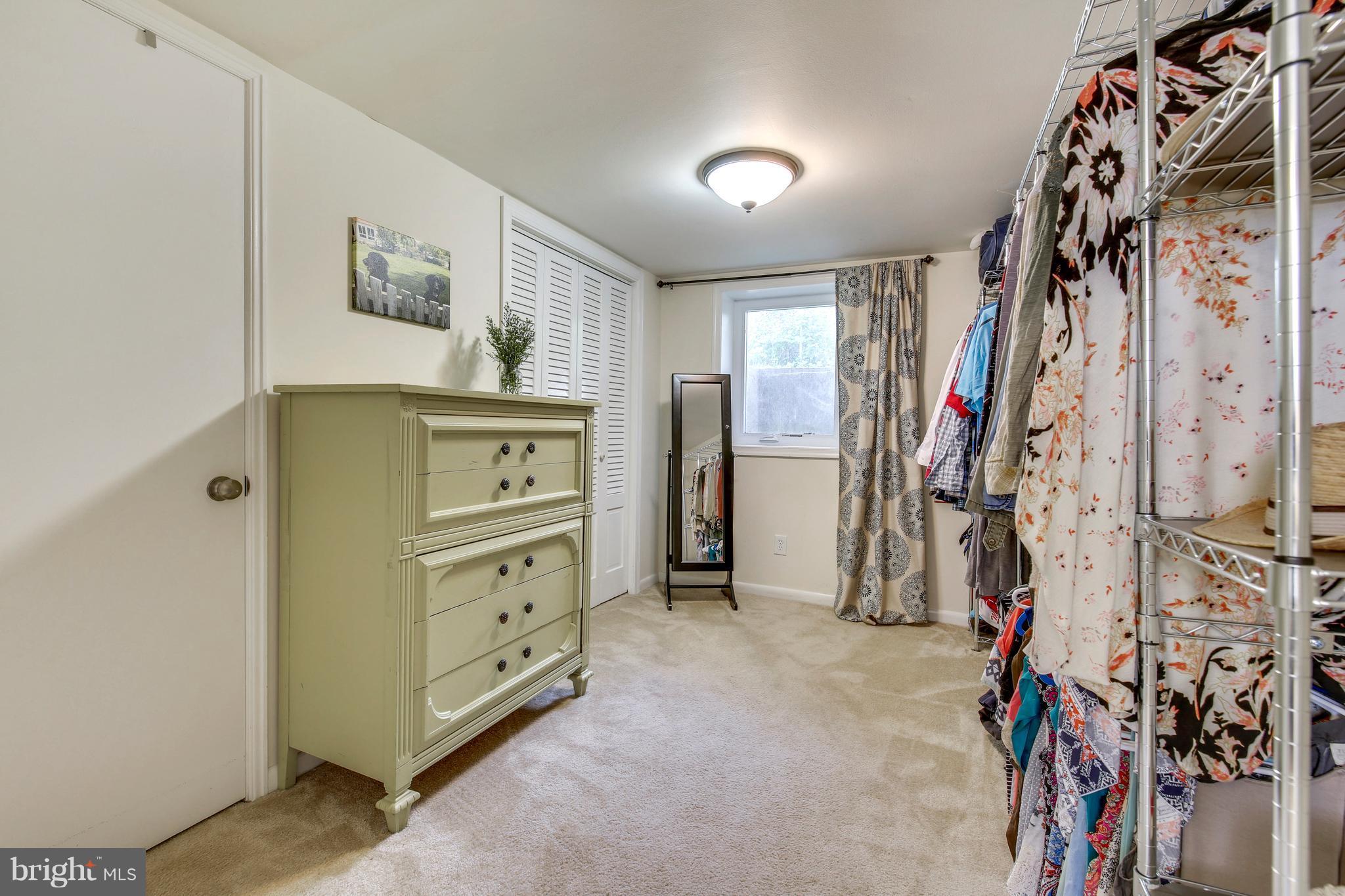 4418 Bennion Road Silver Spring, MD 20906 - Photo 18 of 23 a view of walk in closet with clothes