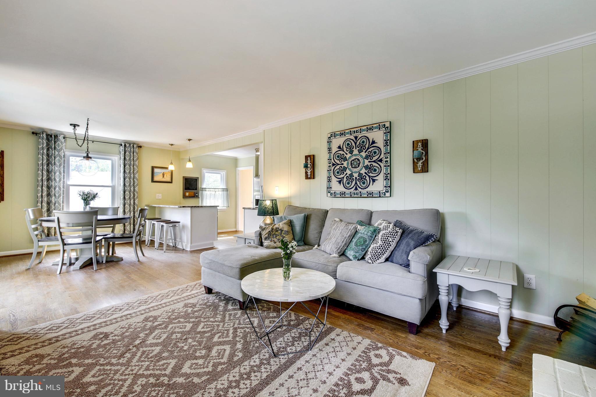 4418 Bennion Road Silver Spring, MD 20906 - Photo 8 of 23 a living room with furniture a rug and a table