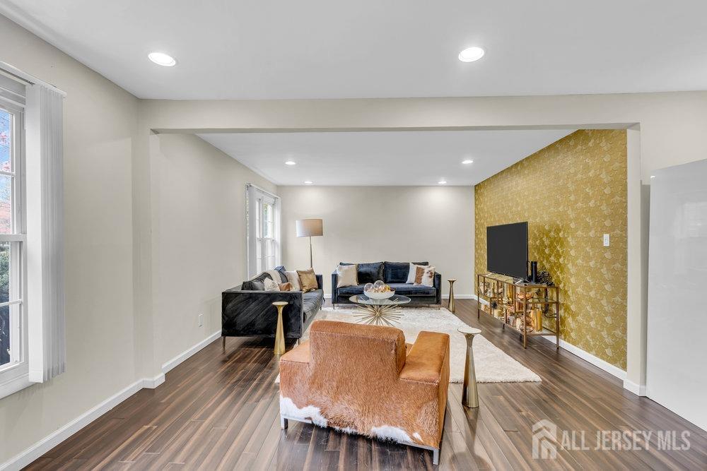 10 Kings Road East Brunswick, NJ 08816 - Photo 11 of 33 a view of a dining room with furniture window and wooden floor