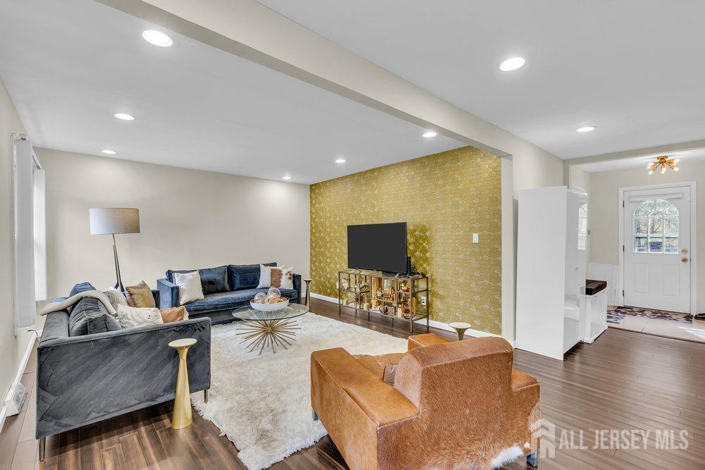10 Kings Road East Brunswick, NJ 08816 - Photo 12 of 33 a living room with furniture and a flat screen tv