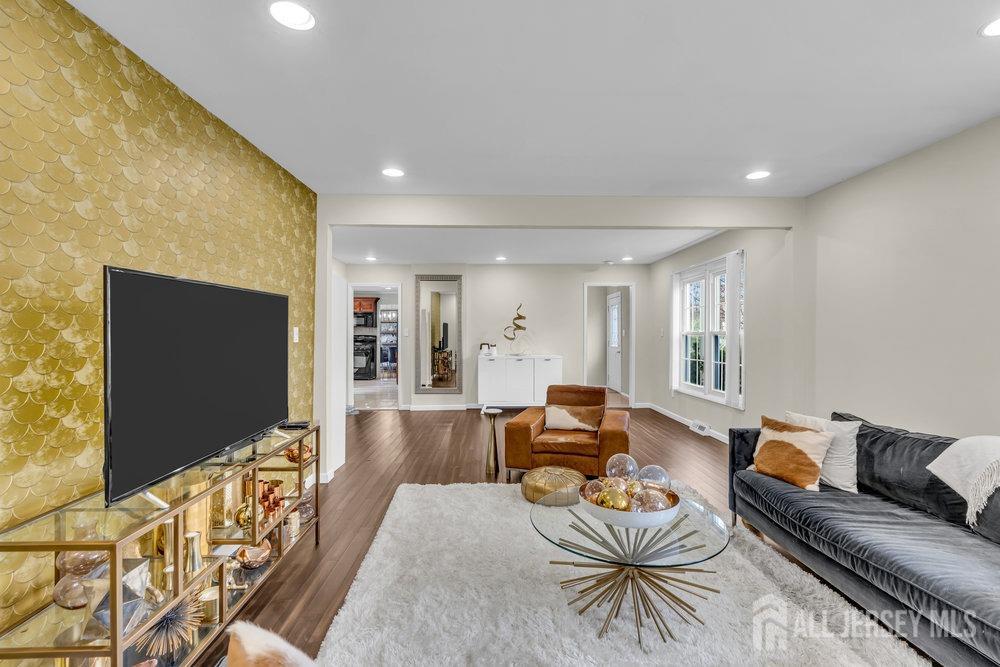 10 Kings Road East Brunswick, NJ 08816 - Photo 13 of 33 a living room with furniture and a flat screen tv
