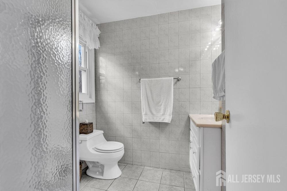 10 Kings Road East Brunswick, NJ 08816 - Photo 20 of 33 a bathroom with a toilet and a shower