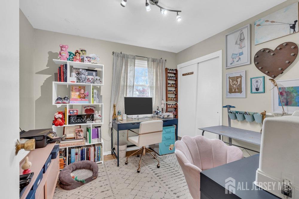 10 Kings Road East Brunswick, NJ 08816 - Photo 26 of 33 a living room with furniture and a flat screen tv