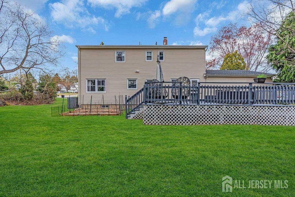 10 Kings Road East Brunswick, NJ 08816 - Photo 29 of 33 a view of a deck with a yard