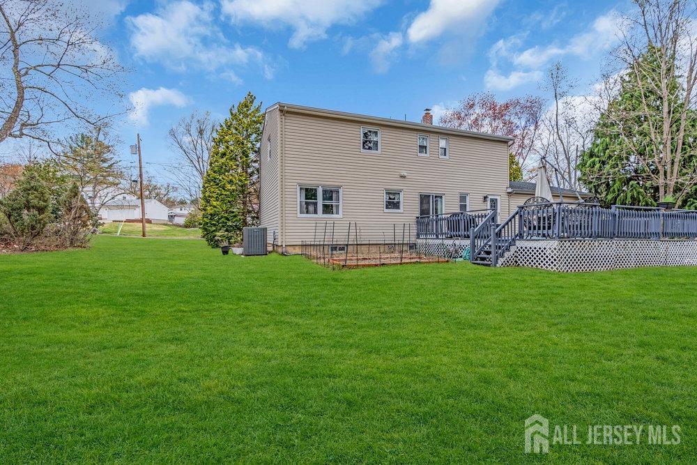 10 Kings Road East Brunswick, NJ 08816 - Photo 30 of 33 a view of an house with backyard space and garden