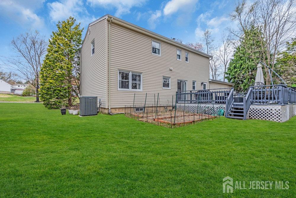 10 Kings Road East Brunswick, NJ 08816 - Photo 32 of 33 a view of a house with a backyard