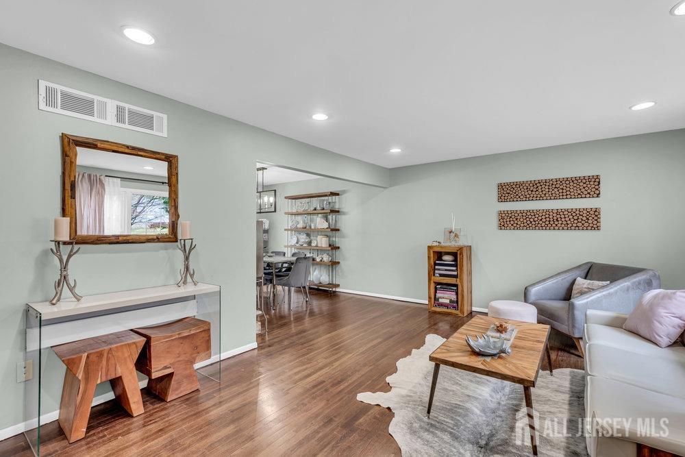 10 Kings Road East Brunswick, NJ 08816 - Photo 8 of 33 a living room with furniture and a wooden floor