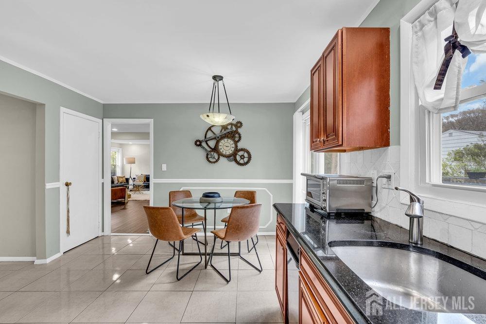 10 Kings Road East Brunswick, NJ 08816 - Photo 10 of 33 a kitchen with stainless steel appliances granite countertop a sink and a refrigerator