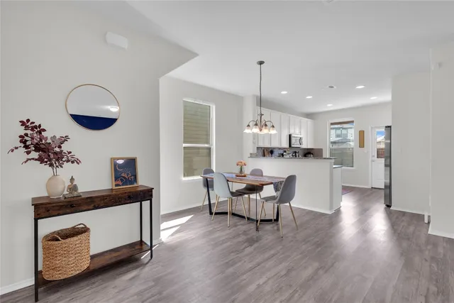 a kitchen with a table and chairs in it