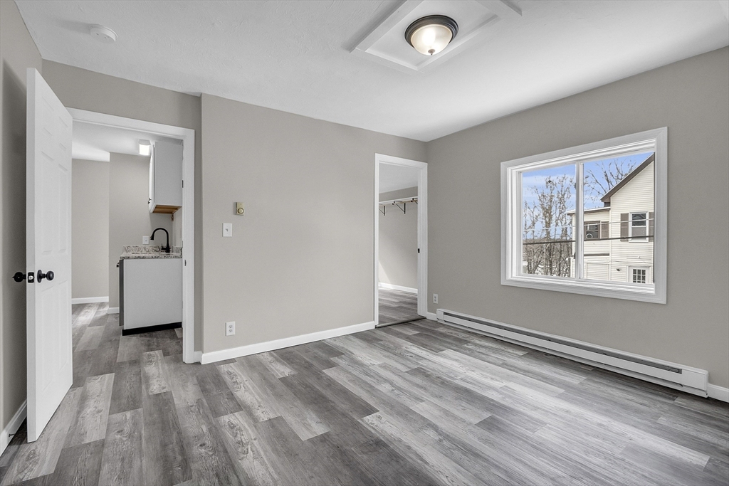 73 Ash Street Gardner, MA 01440 - Photo 11 of 40 a view of an empty room and window