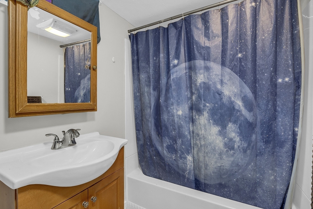 73 Ash Street Gardner, MA 01440 - Photo 17 of 40 a bathroom with a sink and a mirror