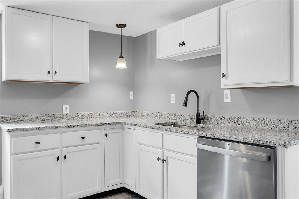 73 Ash Street Gardner, MA 01440 - Photo 20 of 40 a kitchen with appliances cabinets and a sink