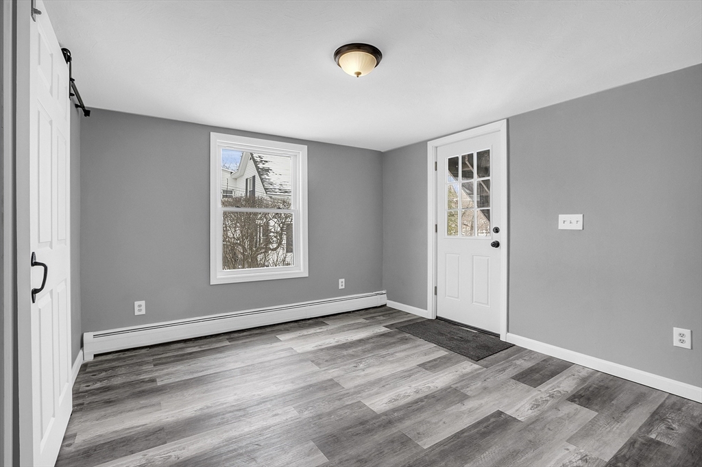73 Ash Street Gardner, MA 01440 - Photo 23 of 40 a view of an empty room with window and closet area