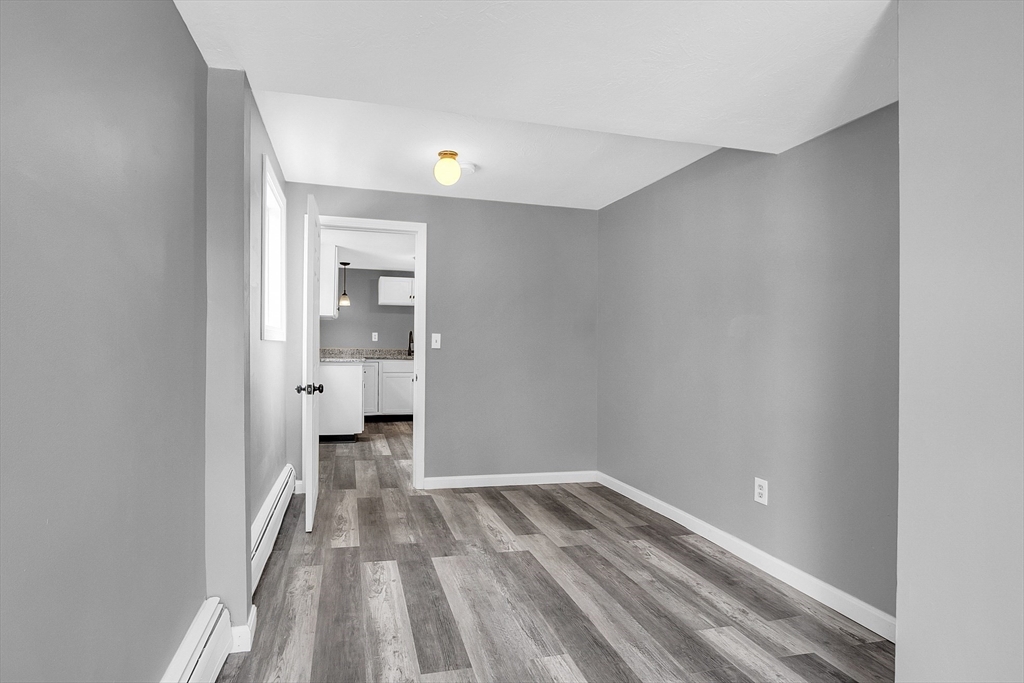 73 Ash Street Gardner, MA 01440 - Photo 24 of 40 a view of wooden floor in a room
