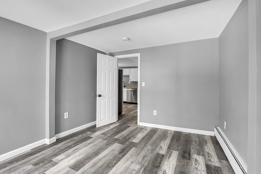 73 Ash Street Gardner, MA 01440 - Photo 25 of 40 a view of a room with wooden floor