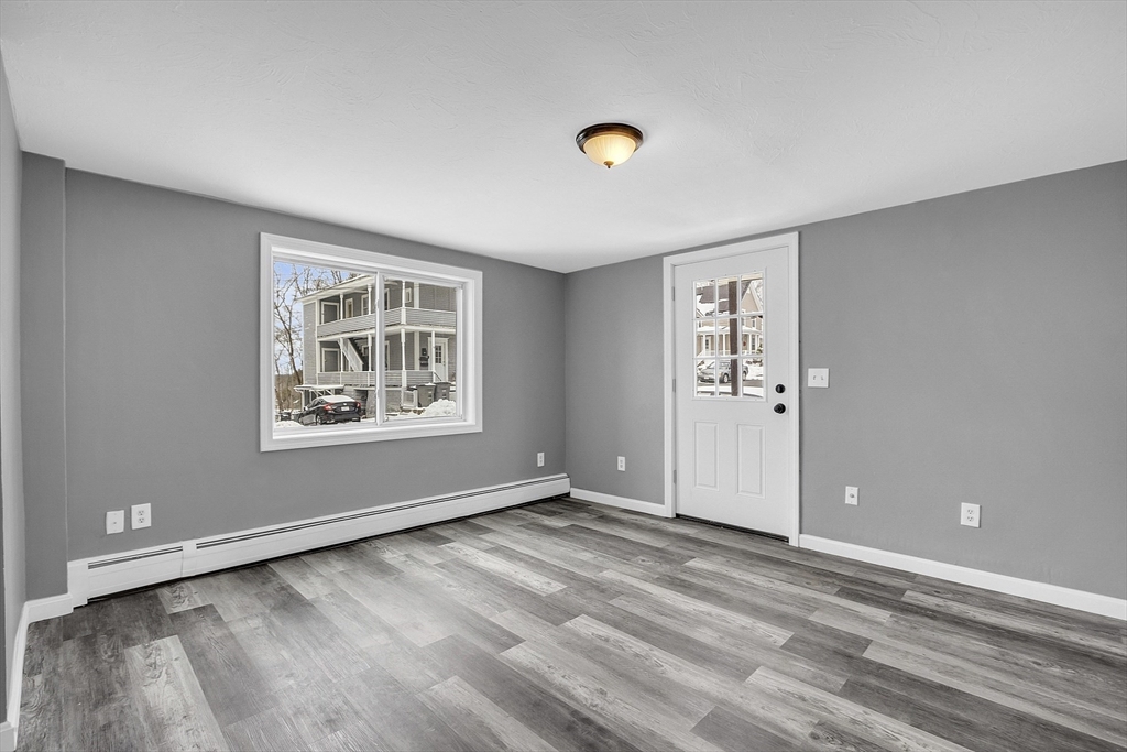 73 Ash Street Gardner, MA 01440 - Photo 26 of 40 a view of livingroom with hardwood floor and window