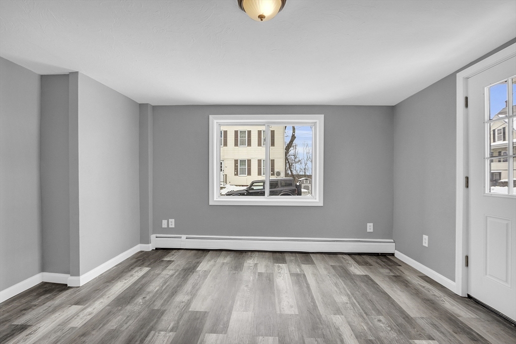 73 Ash Street Gardner, MA 01440 - Photo 27 of 40 wooden floor in an empty room with a window