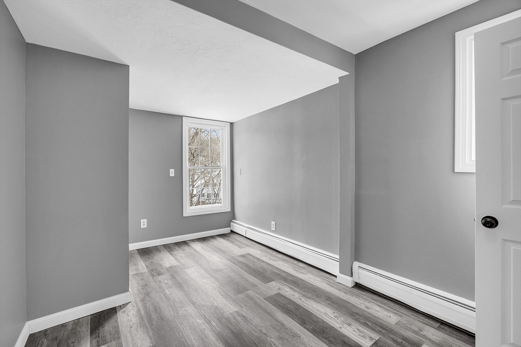 73 Ash Street Gardner, MA 01440 - Photo 30 of 40 wooden floor in an empty room with a window