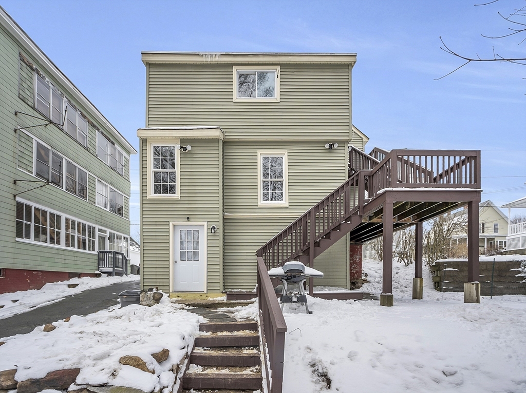 73 Ash Street Gardner, MA 01440 - Photo 37 of 40 a view of a house with wooden roof and wooden fence
