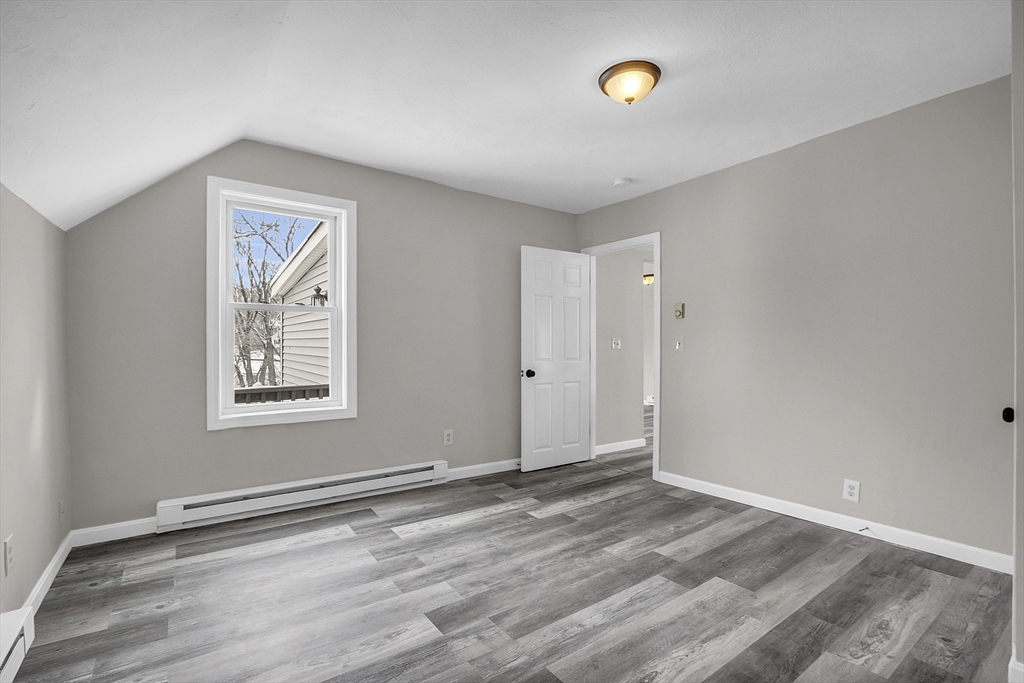 73 Ash Street Gardner, MA 01440 - Photo 8 of 40 a view of an empty room with a window