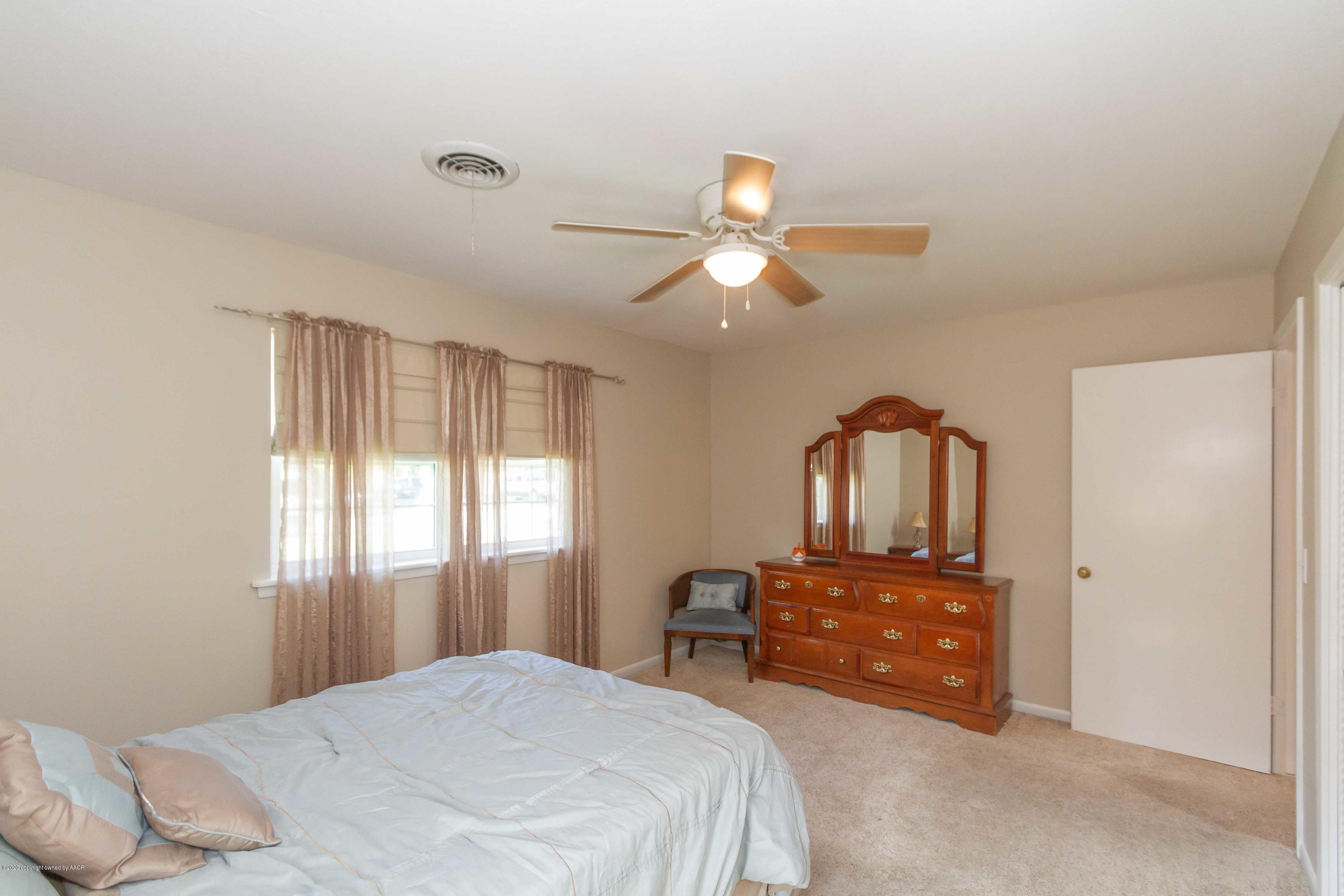 7206 Calumet Road Amarillo, TX 79106 - Photo 36 of 44 a bedroom with a bed and window