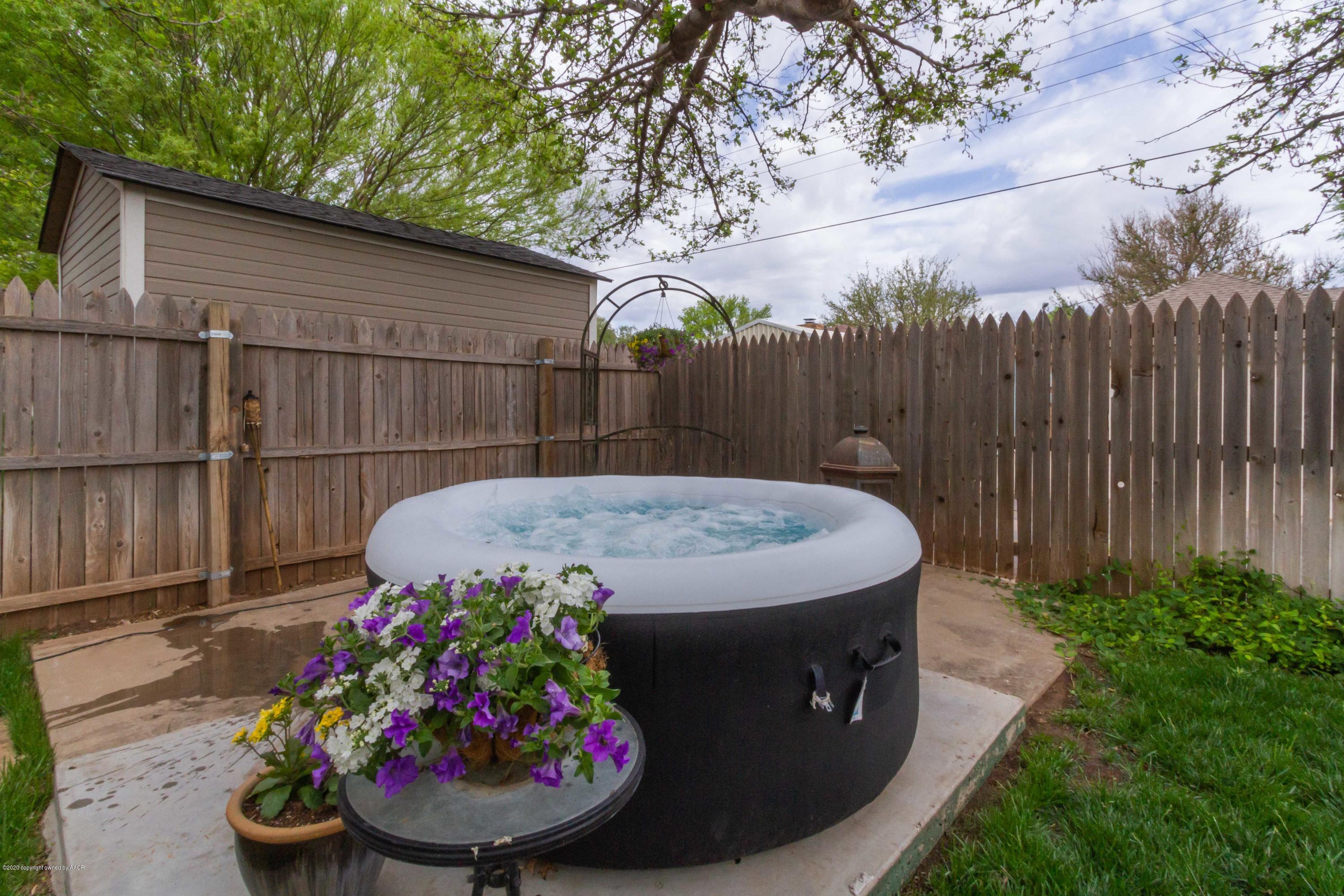 7206 Calumet Road Amarillo, TX 79106 - Photo 42 of 44 a view of a backyard with a fountain and plants
