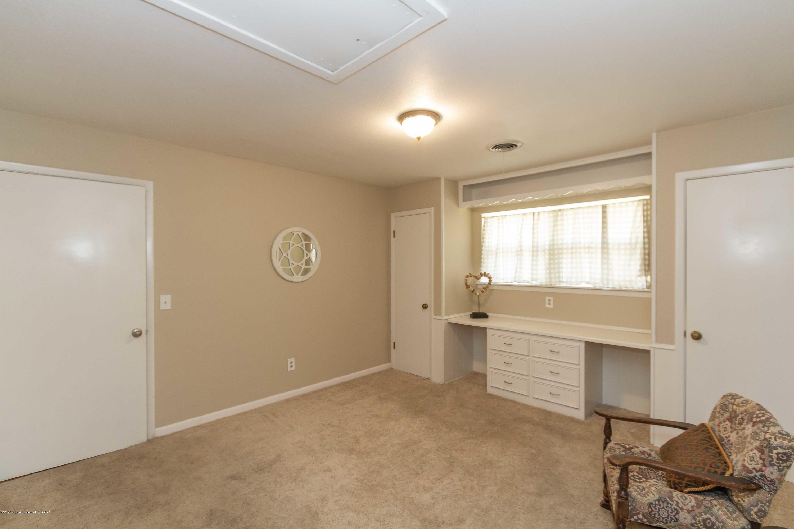 7206 Calumet Road Amarillo, TX 79106 - Photo 8 of 44 a view of an empty room with a window