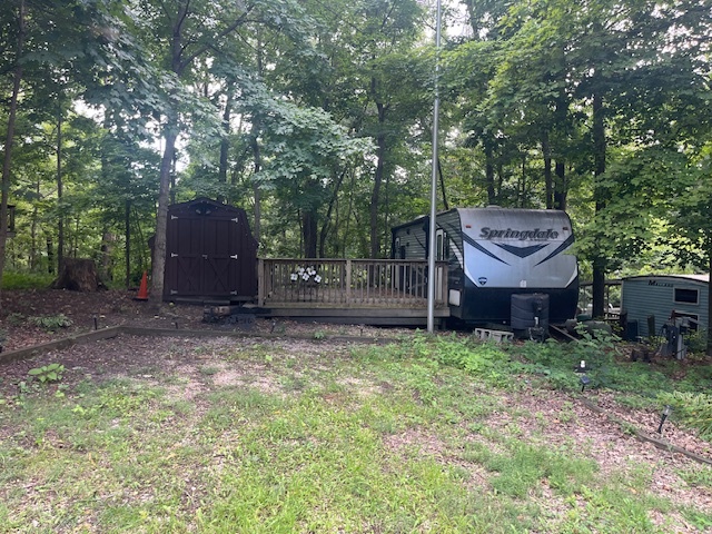 2795 East 28th Road Marseilles, IL 61341 - Photo 2 of 49 a view of a backyard with a barn and a large tree