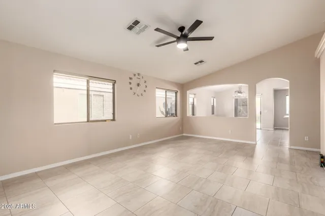 a view of a livingroom with a ceiling fan and window