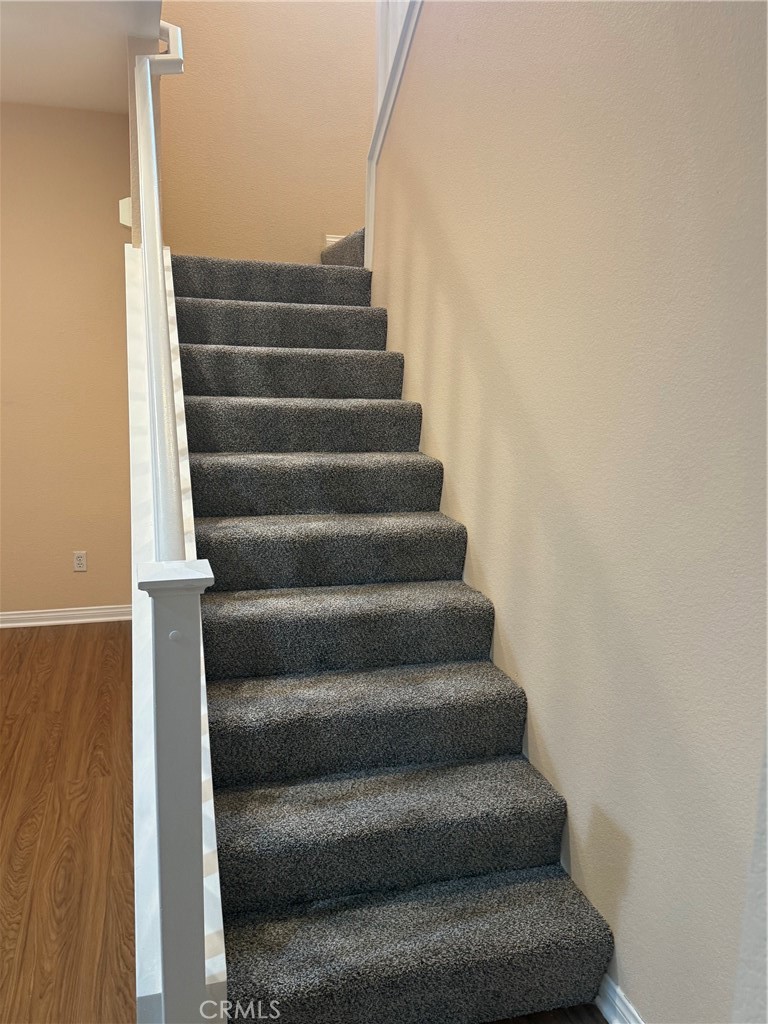 4420 Kristen Court Riverside, CA 92501 - Photo 18 of 39 STAIRS WITH WOOD BANNISTER TO SECOND LEVEL