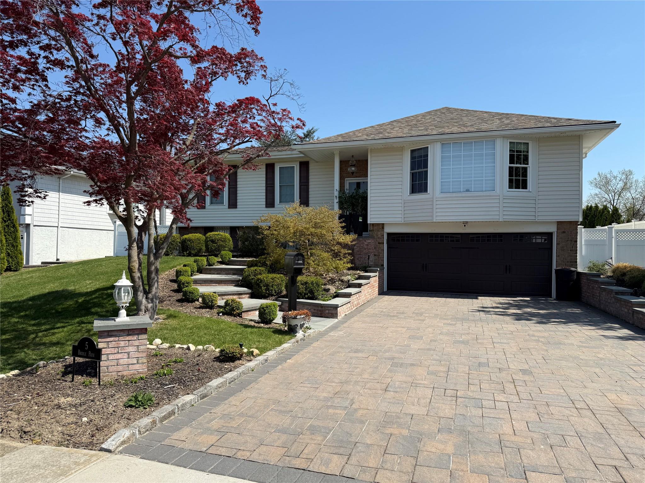 5 Bridle Path Roslyn, NY 11576 - Photo 1 of 1 a front view of a house with yard and trees