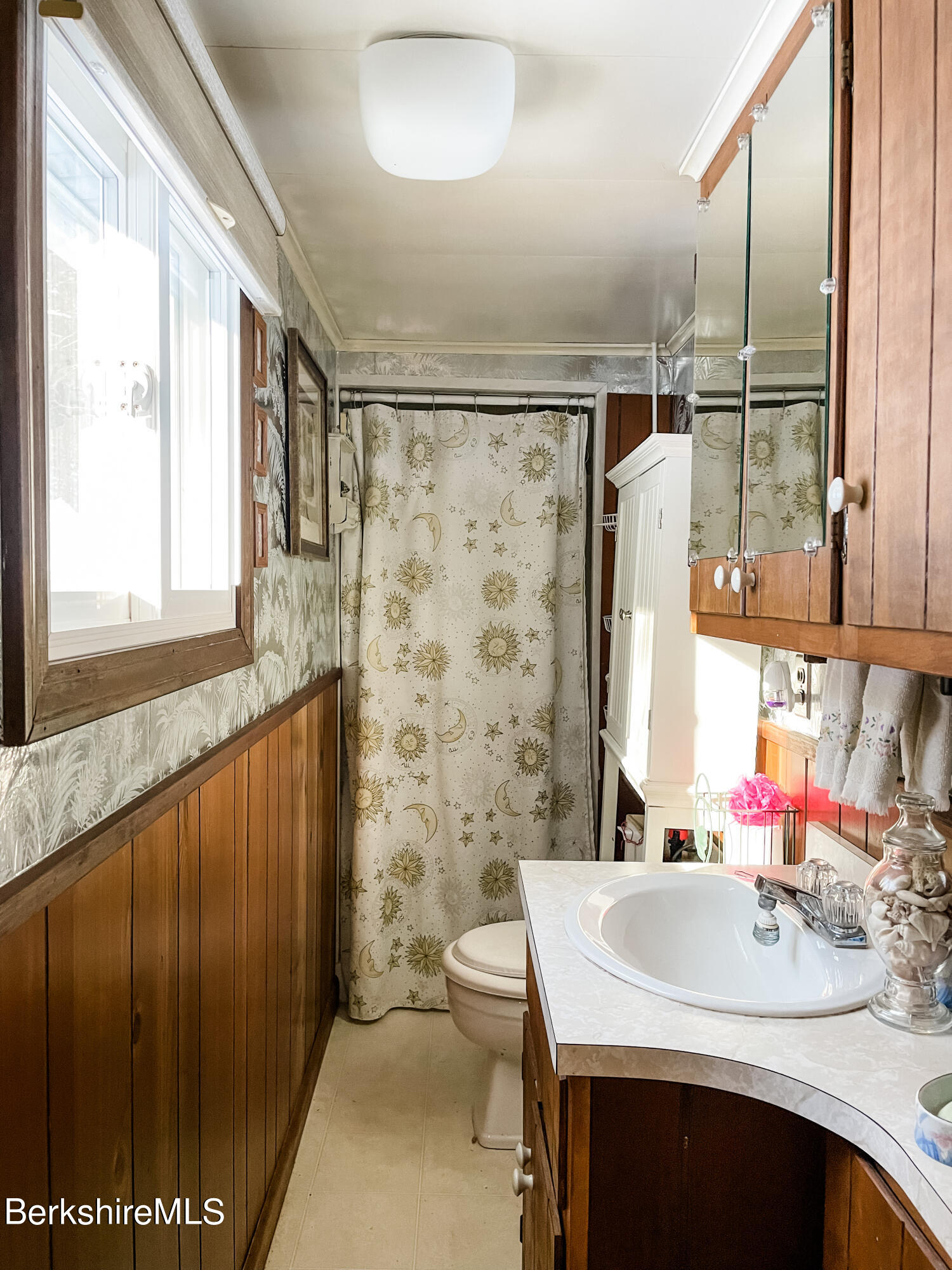 100 Highland Road Becket, MA 01223 - Photo 14 of 22 a bathroom with a sink and a mirror