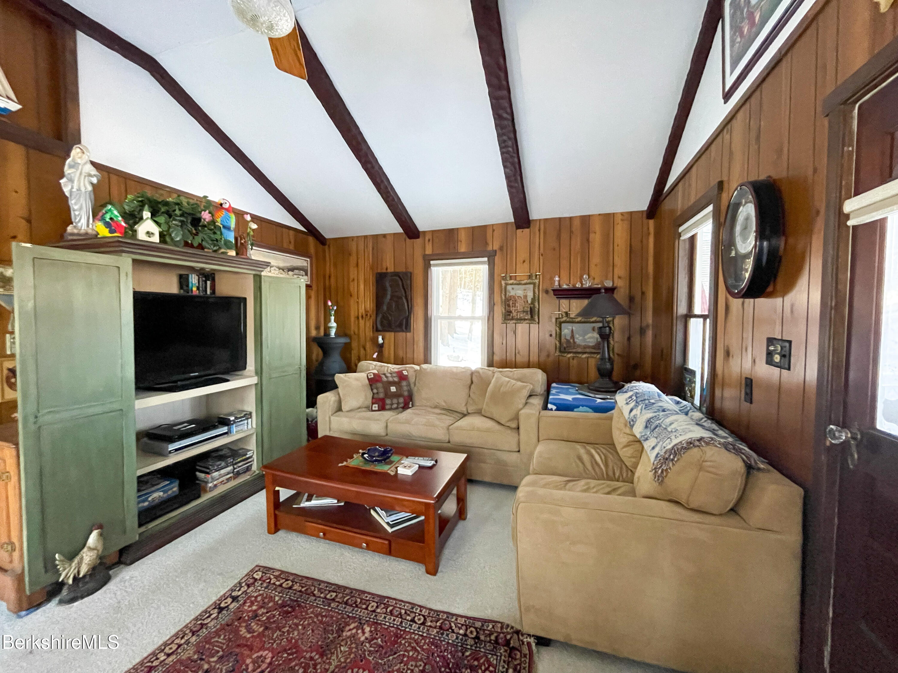 100 Highland Road Becket, MA 01223 - Photo 5 of 22 a living room with furniture and a flat screen tv