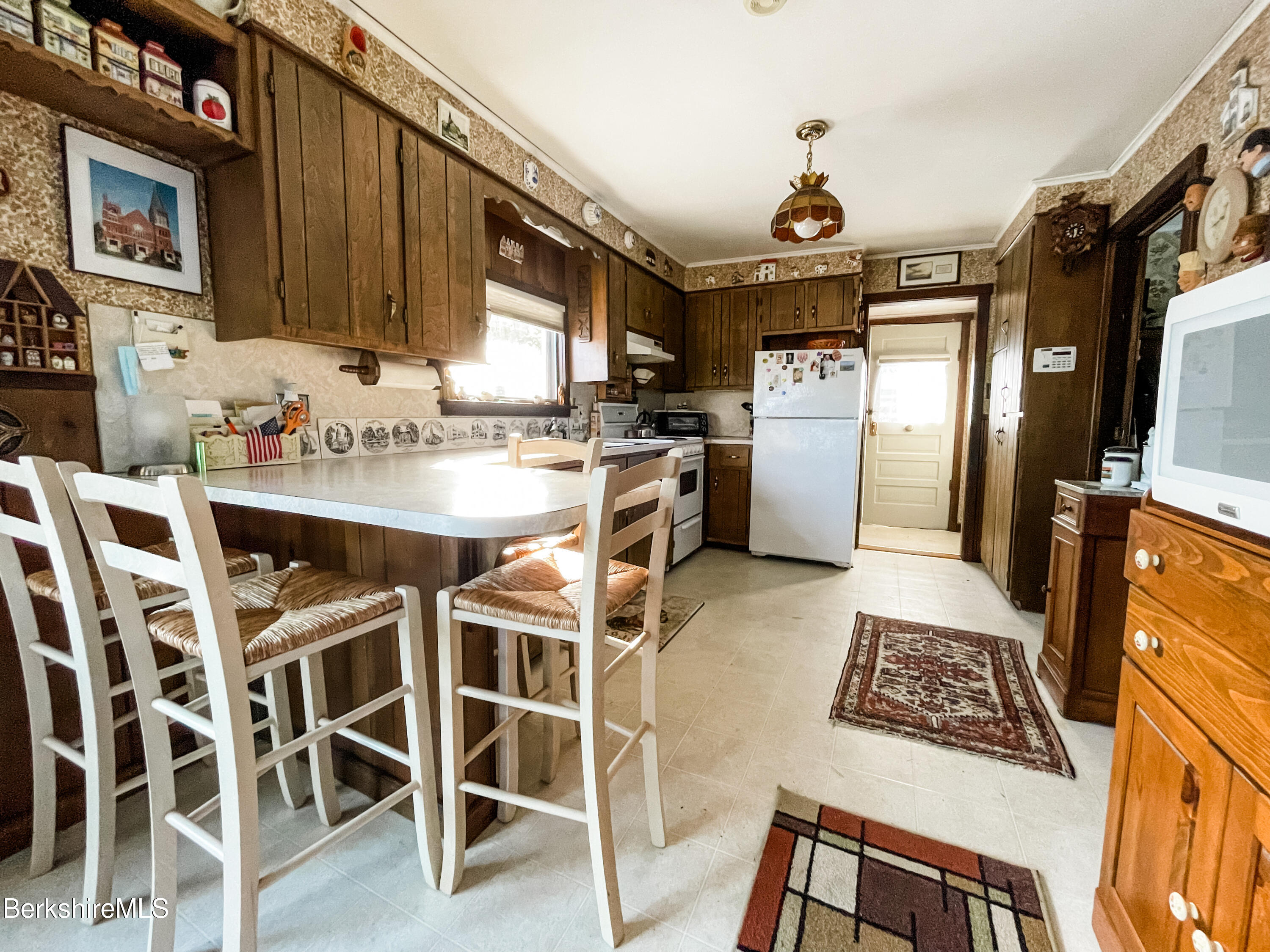 100 Highland Road Becket, MA 01223 - Photo 8 of 22 a kitchen with stainless steel appliances granite countertop a stove and a refrigerator