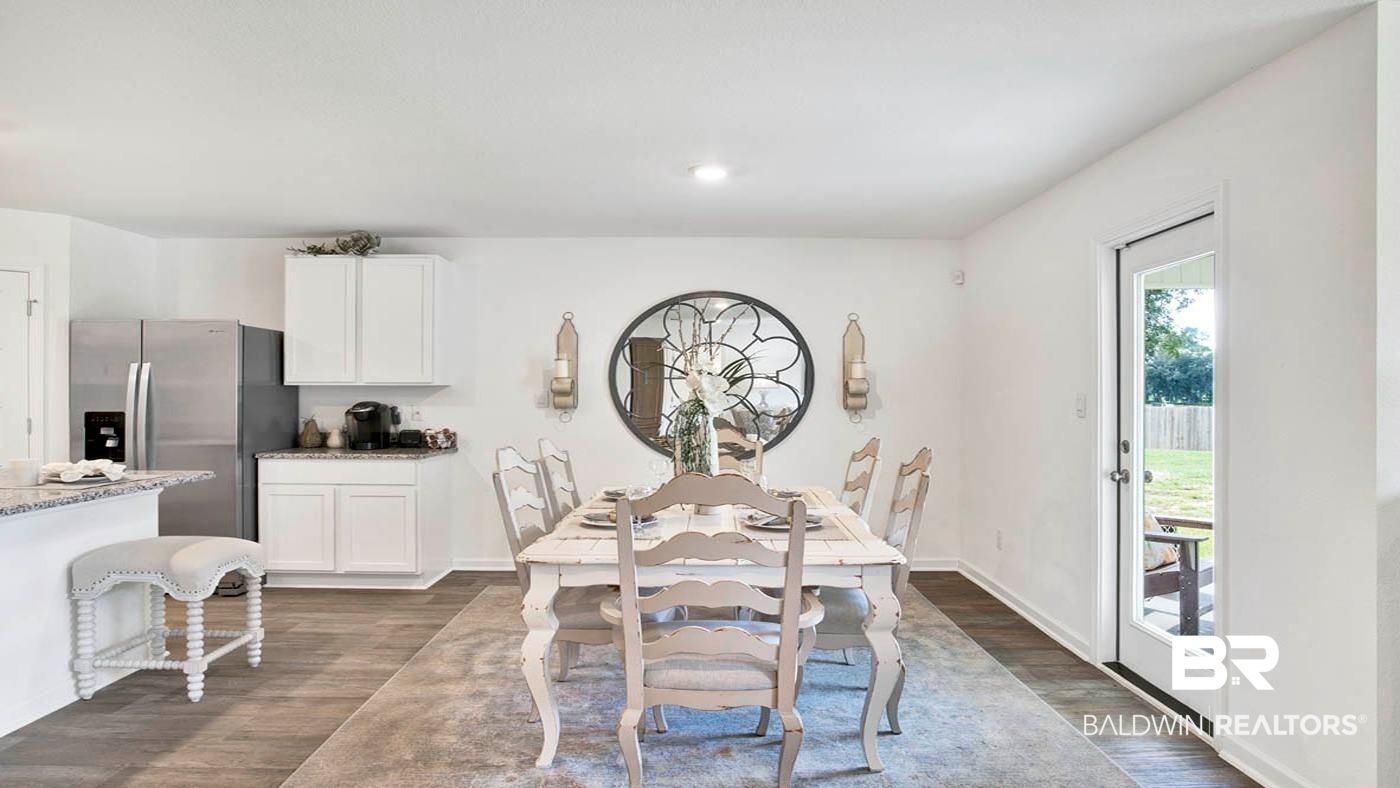 24718 Ponder Loop Loxley, AL 36551 - Photo 22 of 31 Dining area with dark wood-type flooring