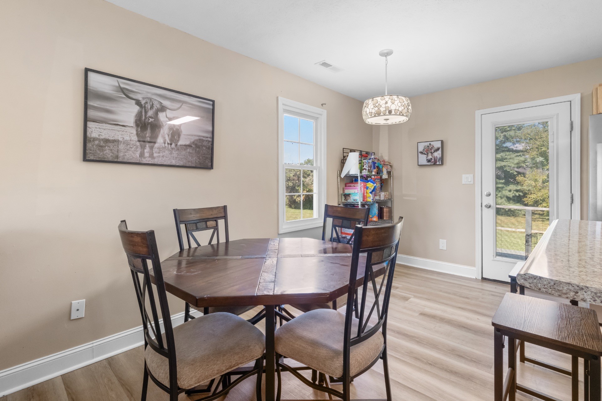 586 Foxfield Road Hopkinsville, KY 42240 - Photo 12 of 30 a view of a dining room with furniture window and wooden floor